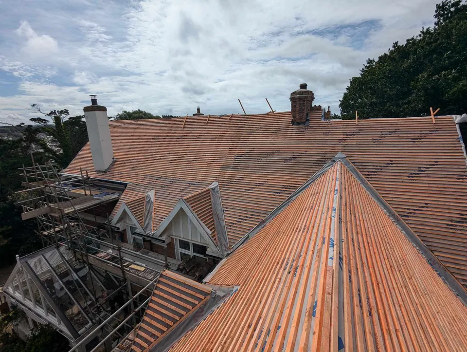 During: stripped and re-battened over new membrane