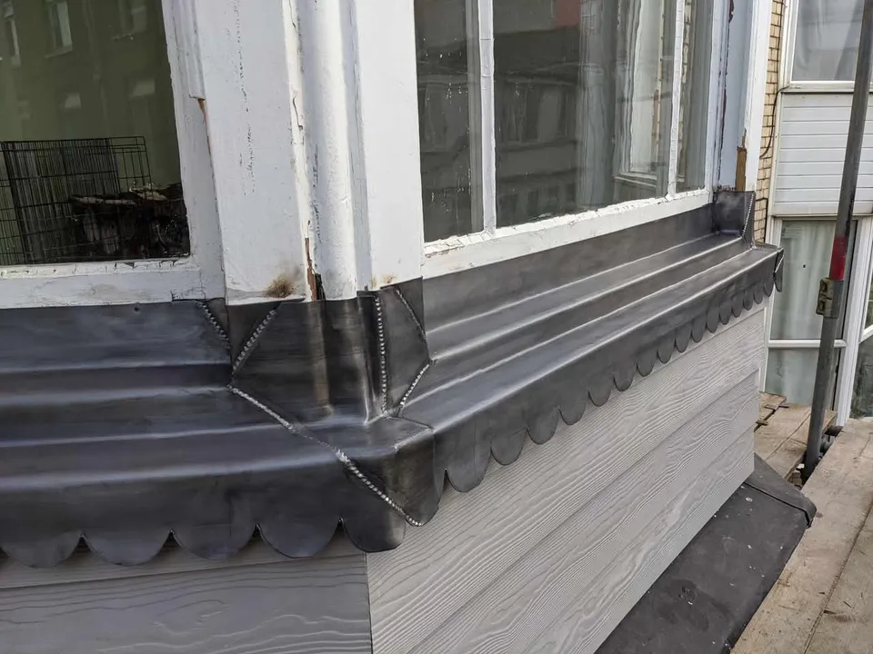 New lead over a bay window, finished with a scalloped edge